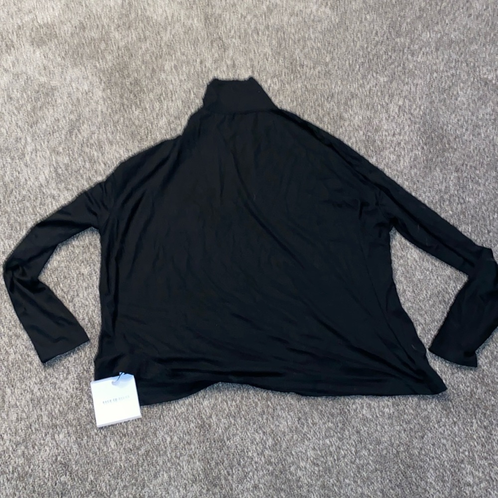 Black turtleneck basic layer.